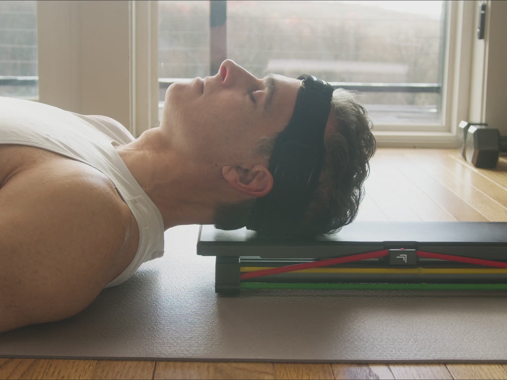 NecksLevel Glide pro in use doing chin tucks on mat